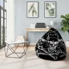 A modern living room with a bean bag chair, a desk, and artwork on the wall. Podgląd zdjęcia produktu