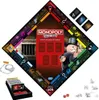 A Monopoly board game with a crime/deception theme, laid out diagonally on a white background. It includes game pieces, dice, cards, and a game board. Produktbild-Vorschau