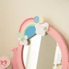 A close-up view of a pink vanity mirror with rainbow and cloud decorations. Podgląd zdjęcia produktu
