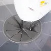 A close-up view of a mixer attachment being inserted into a splash guard for a blender or mixer. Produktbild-Vorschau