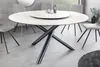 A modern dining room with a round dining table and chairs. Produktbild-Vorschau