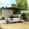 An outdoor patio scene with a sectional sofa and a large umbrella. Náhľad obrázku produktu