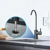 A black faucet installed in a modern kitchen sink, with a close-up inset showing installation dimensions. Produktbild-Vorschau