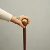 Weltkugel Spazierstock aus Holz mit goldenem Griff aus Produktbild-Vorschau 3
