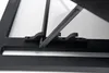A close-up view of a black metal frame with a dark gray plastic hinge mechanism. Produktbild-Vorschau