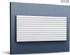 A white decorative panel with a zigzag pattern is mounted on a dark gray wall. Náhľad obrázku produktu