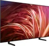 A television set with a black frame and stand, displaying a colorful abstract image. Produktbild-Vorschau