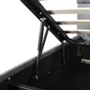 Close-up view of the internal mechanism of a bed frame, specifically a gas lift strut and metal frame. Anteprima dell’immagine prodotto
