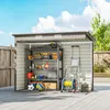 An outdoor storage shed filled with various tools and garden equipment, set on a wooden deck. Produktbild-Vorschau
