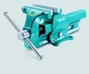 A teal colored metal vise is shown against a light gray background. Anteprima dell’immagine prodotto