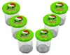 A group of six empty glass jars with green lids, each featuring a cartoon character wearing a Santa hat and text. Produktbild-Vorschau