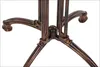 Close-up of a dark bronze table base with a pedestal design. Podgląd zdjęcia produktu