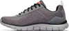 Side view of a gray athletic shoe. Voir les images du produit