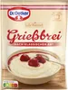 A pouch of Dr. Oetker Griessbrei (semolina pudding) with a bowl of prepared pudding topped with cherries and syrup. Náhľad obrázku produktu