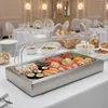 A buffet serving tray filled with sushi and other food items, set up on a table in what appears to be a formal dining or event setting. Produktbild-Vorschau