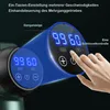 Close-up of a massage gun's digital display and controls, with a hand interacting with it. Produktbild-Vorschau