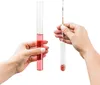 Two hands holding laboratory equipment with liquid. Produktbild-Vorschau