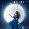 A woman in a blue dress swings in front of a large moon and starry sky. Podgląd zdjęcia produktu