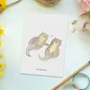 Mr. & Mrs. Panda Postkarte Otter Hände halten - Weiß - Produktbild-Vorschau 2