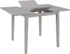 A light gray extendable dining table is shown against a white background. Náhled obrázku produktu