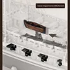 A close-up view of a wooden ship model, highlighting a canoe-shaped control mechanism and cannons. Náhled obrázku produktu