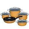 A set of orange cookware with glass lids, including pots and a frying pan, arranged on a white background. Podgląd zdjęcia produktu