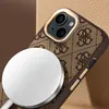 A close-up shot of an iPhone case with a repeating logo pattern, attached to a white magnetic charger. Náhled obrázku produktu