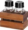 A set of salt and pepper shakers in a wooden holder. Náhľad obrázku produktu