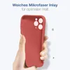 A hand holding a red phone case against a white background. Produktbild-Vorschau