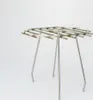 A stainless steel grate with three legs, presented against a white background. Produktbild-Vorschau