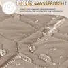 Close-up of a taupe fabric with water droplets on it, indicating waterproofness. Náhled obrázku produktu