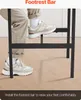 A person's feet are shown resting on the footrest bar of a table, demonstrating its use. Produktbild-Vorschau