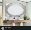 A bathroom vanity with a mirror and a light fixture above it. Produktbild-Vorschau