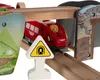 A close-up view of a toy train set with a red locomotive passing under a wooden bridge. Podgląd zdjęcia produktu