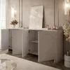 A modern living room with a white sideboard, artwork, and decorative items. Produktbild-Vorschau