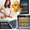 A woman is preparing fruit in a kitchen, with a food dehydrator prominently displayed. Náhled obrázku produktu