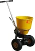 A yellow and silver fertilizer spreader with black wheels, shown against a white background. Náhled obrázku produktu