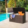 An outdoor storage box sits next to a swimming pool, filled with cushions and towels. Produktbild-Vorschau