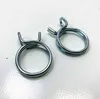 Two metal hose clamps on a white surface. Produktbild-Vorschau