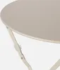 A close-up of a beige bistro table. Produktbild-Vorschau