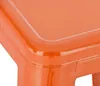 A close-up of the corner of an orange metal bar stool. Náhľad obrázku produktu