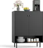 A dark gray sideboard cabinet with two doors and an open shelf below, displaying kitchenware and decorative items on a white background. Podgląd zdjęcia produktu