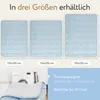 Three sizes of a light blue blanket are displayed side-by-side, with dimensions labeled below each. A washing machine and a folded blanket are shown in the bottom left corner, with care instructions in the bottom right. Produktbild-Vorschau