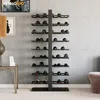 A modern living room or bar area with a concrete wall and a stylish wine rack filled with wine bottles. Podgląd zdjęcia produktu