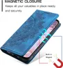 A blue flip phone case with a mandala pattern is shown open, revealing a phone screen. Arrows indicate the magnetic closure feature. Produktbild-Vorschau