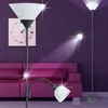 A living room scene with a purple couch and a purple wall, featuring three floor lamps. Produktbild-Vorschau