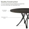 A close-up of a round dining table, highlighting its construction and design. Anteprima dell’immagine prodotto