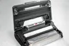 An open vacuum sealer with a roll of sealing bag inside. Podgląd zdjęcia produktu