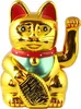 A golden Maneki Neko cat figurine with a red collar and green bib, holding a gold ingot. Produktbild-Vorschau