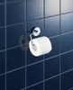 A toilet paper holder with a roll of toilet paper attached, mounted on a dark blue tiled wall. Produktbild-Vorschau